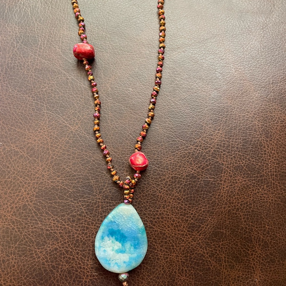 Handmade necklace featuring a large, sky blue Jasper pendant. New, never worn.